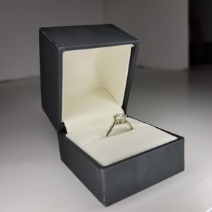 0.71 Artisan Diamond Ring. Size 4.5 set in 19kt White Gold.